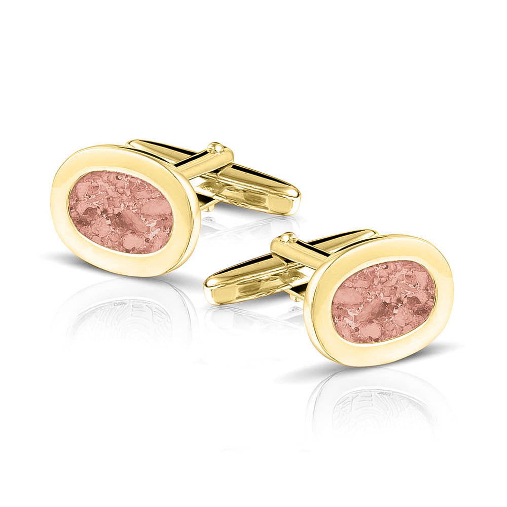 Manchetknopen met as, zichtbaar gevuld, als herinneringssieraad. blush