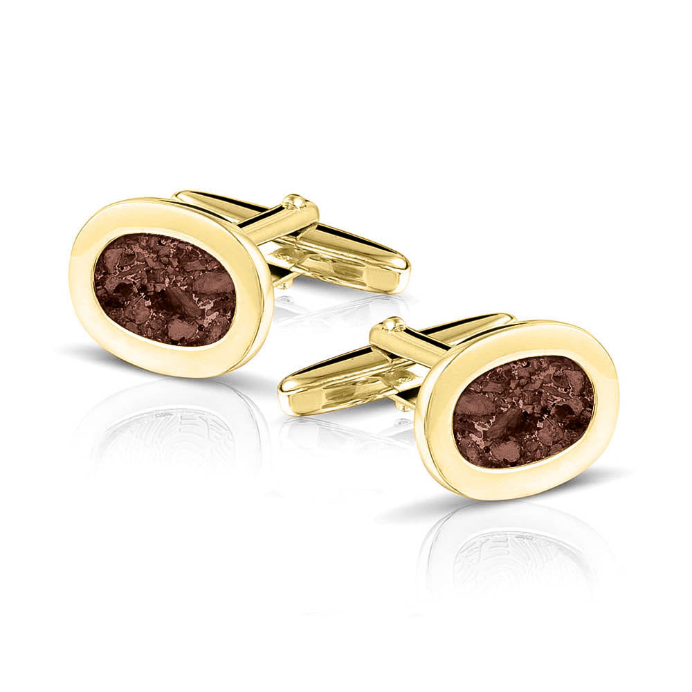 Manchetknopen met as, zichtbaar gevuld, als herinneringssieraad. brown