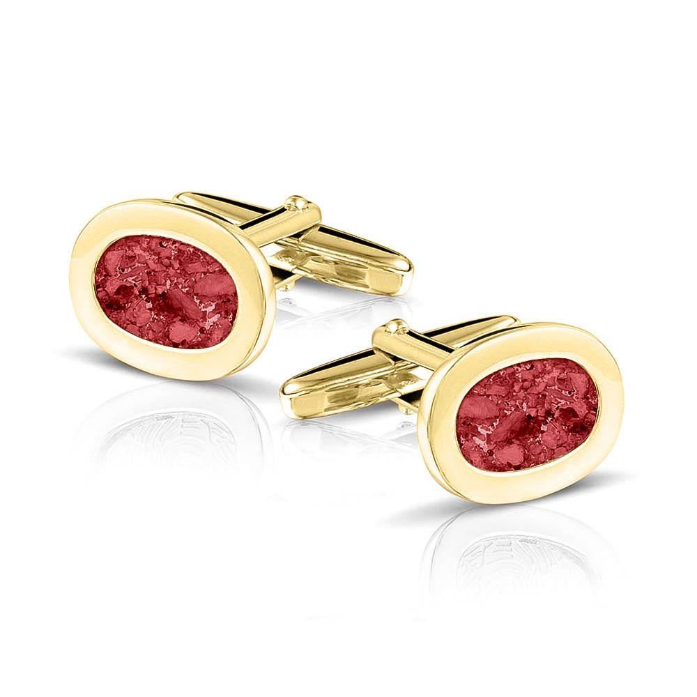 Manchetknopen met as, zichtbaar gevuld, als herinneringssieraad. red