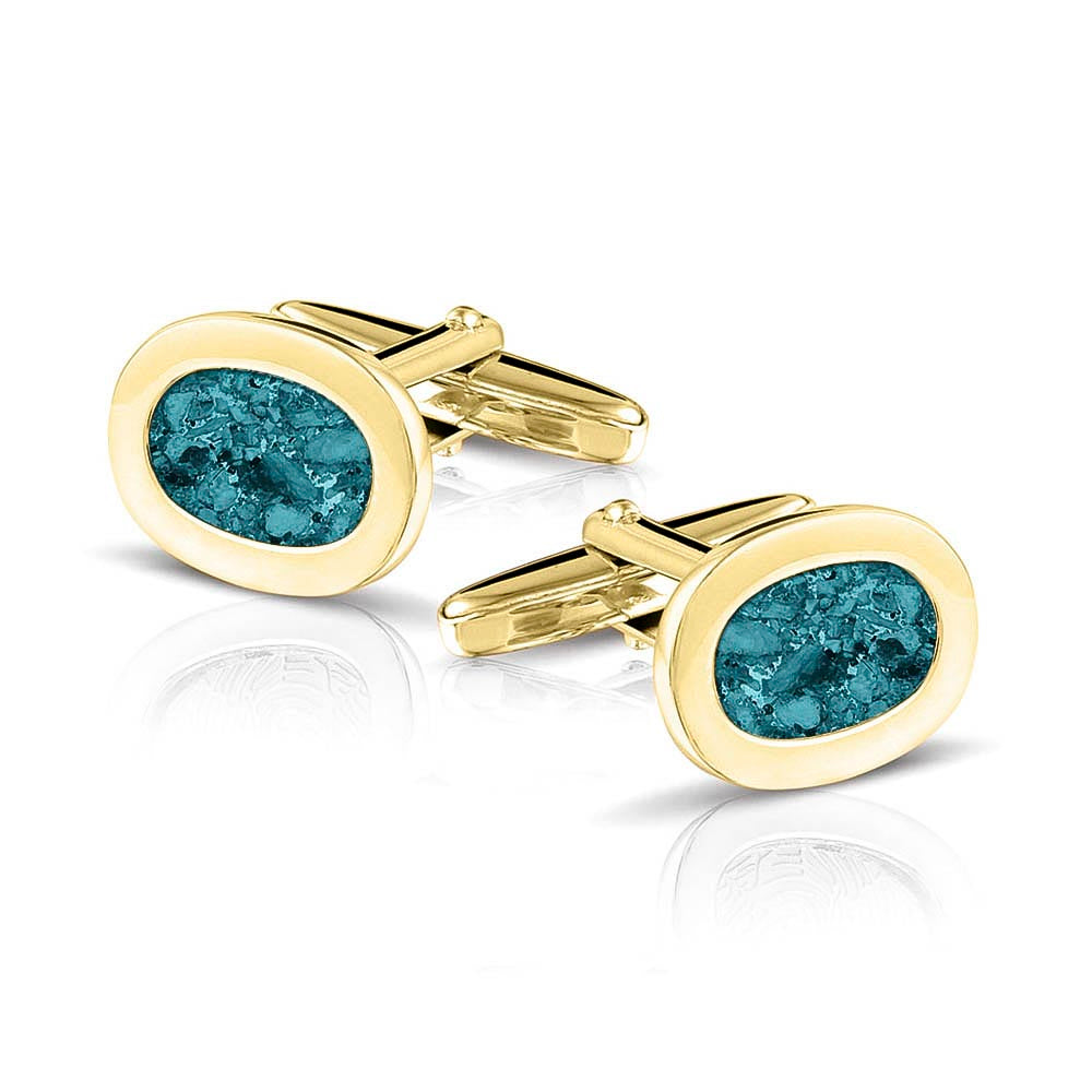 Manchetknopen met as, zichtbaar gevuld, als herinneringssieraad. turquoise