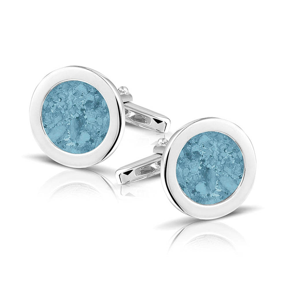 Ronde manchetknopen met as, zichtbaar gevuld, als herinneringssieraad. Baby