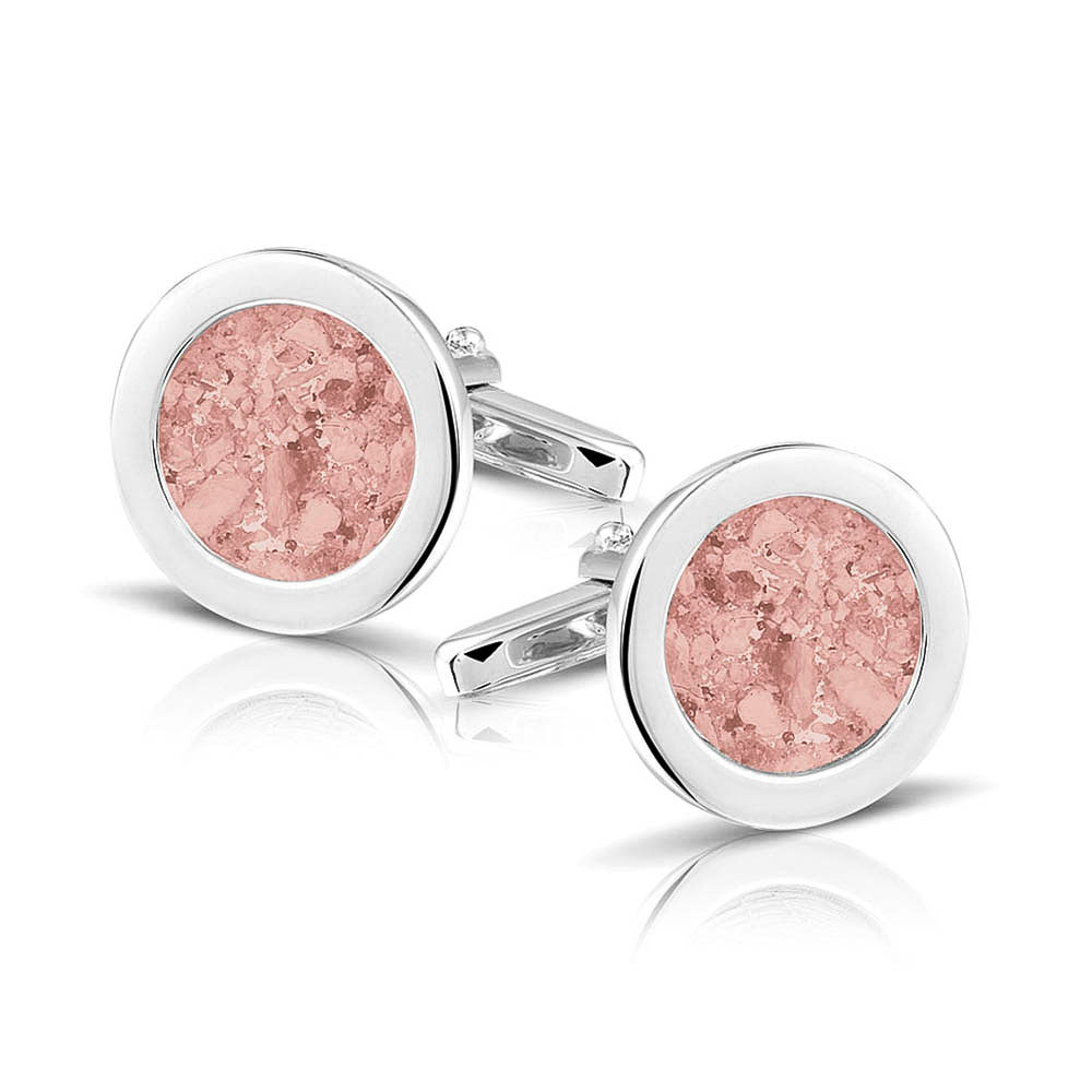 Ronde manchetknopen met as, zichtbaar gevuld, als herinneringssieraad. Blush