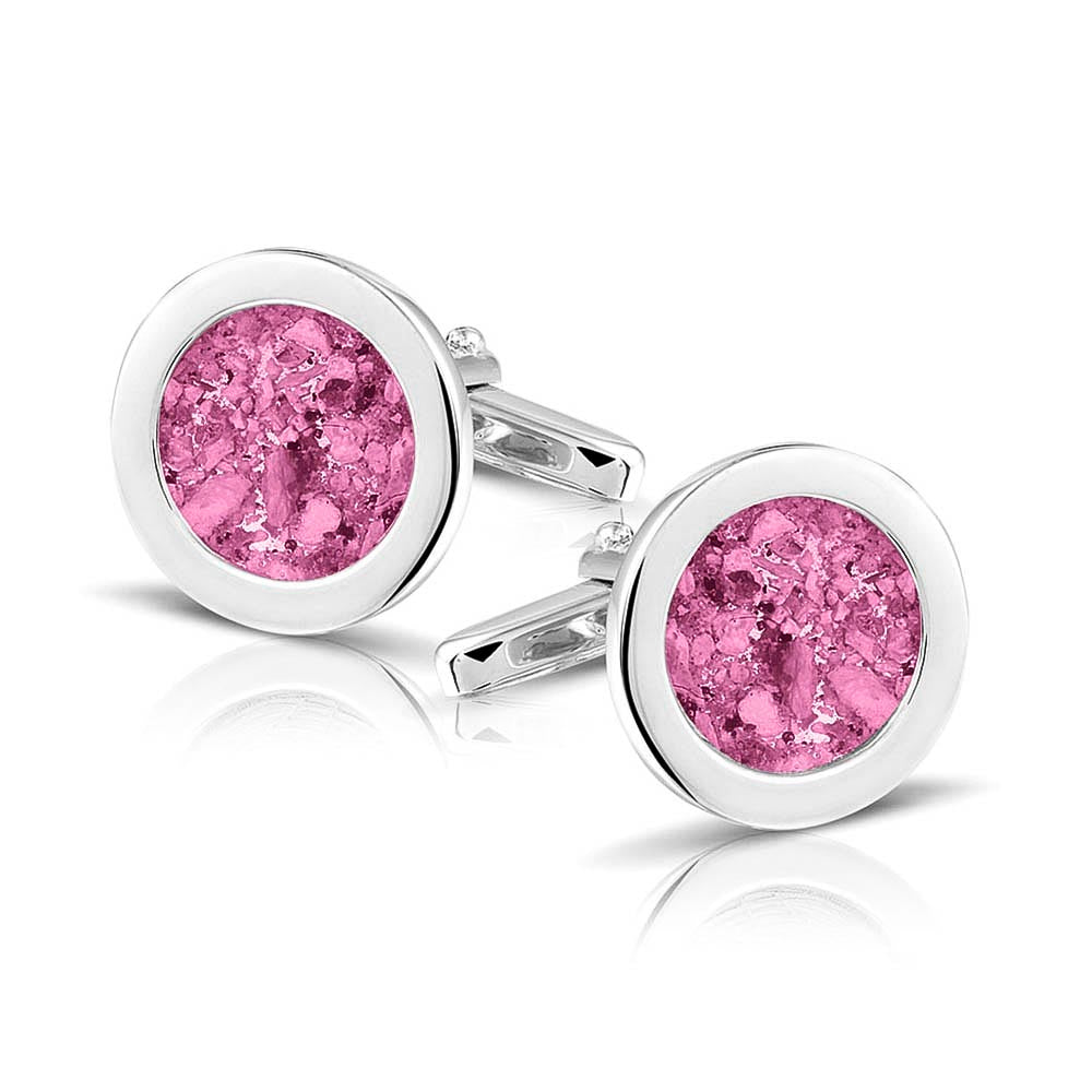 Ronde manchetknopen met as, zichtbaar gevuld, als herinneringssieraad. Fluo