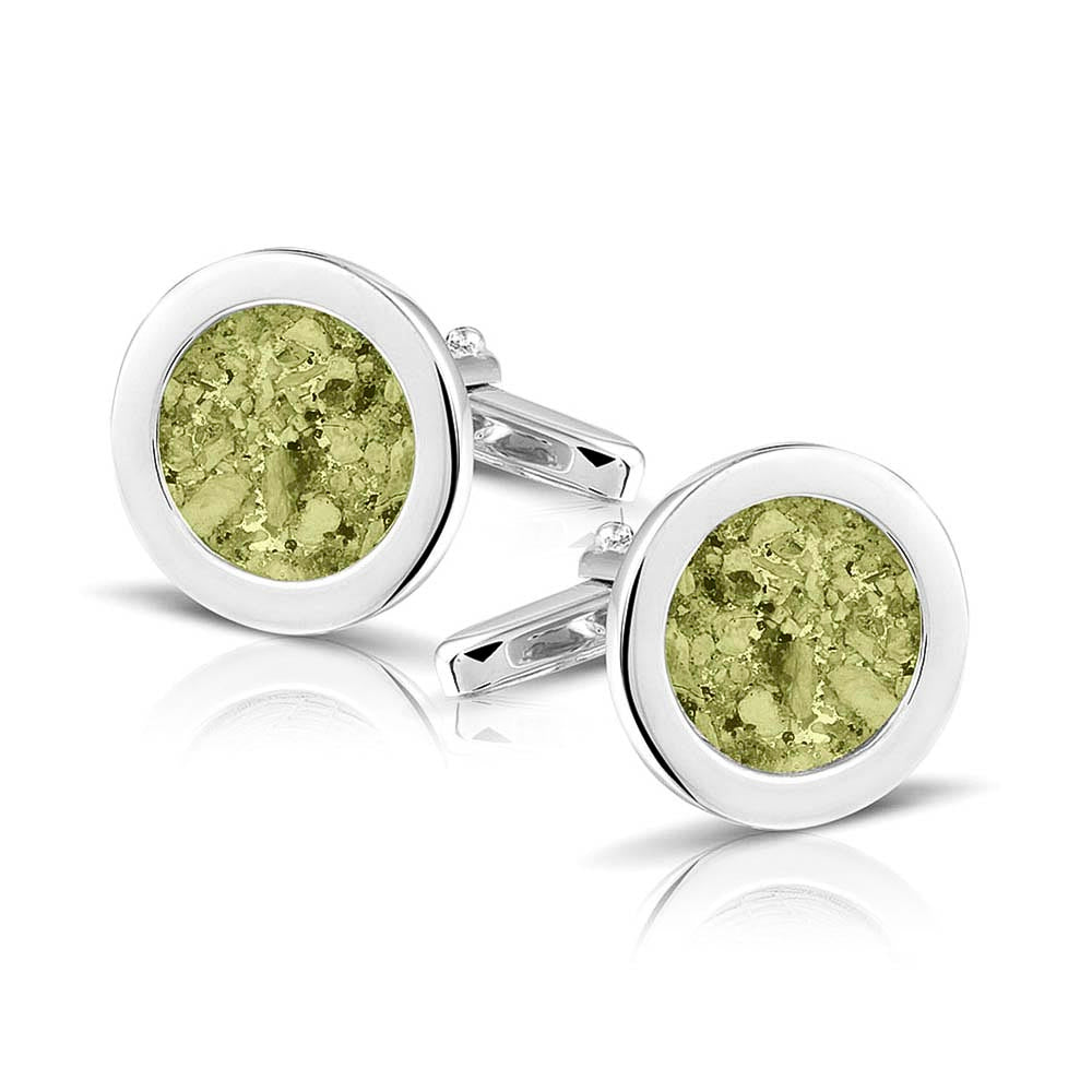 Ronde manchetknopen met as, zichtbaar gevuld, als herinneringssieraad. Olive