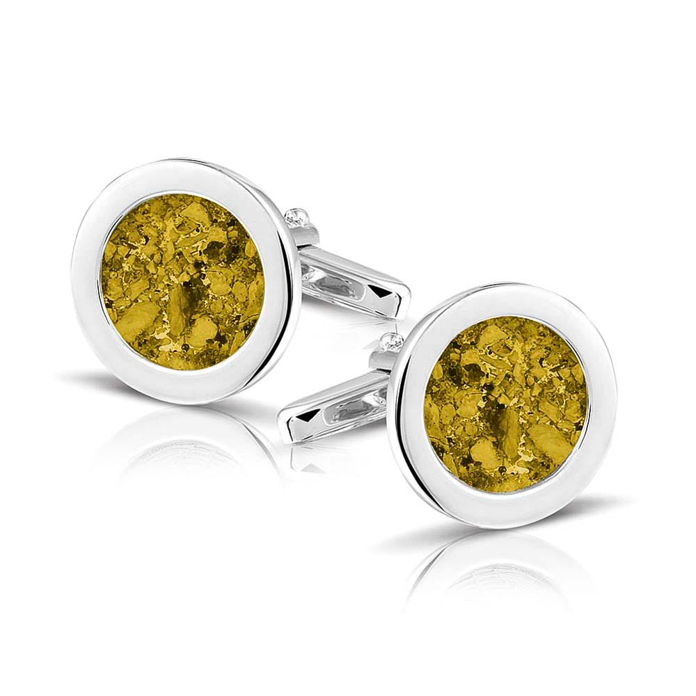 Ronde manchetknopen met as, zichtbaar gevuld, als herinneringssieraad. Yellow