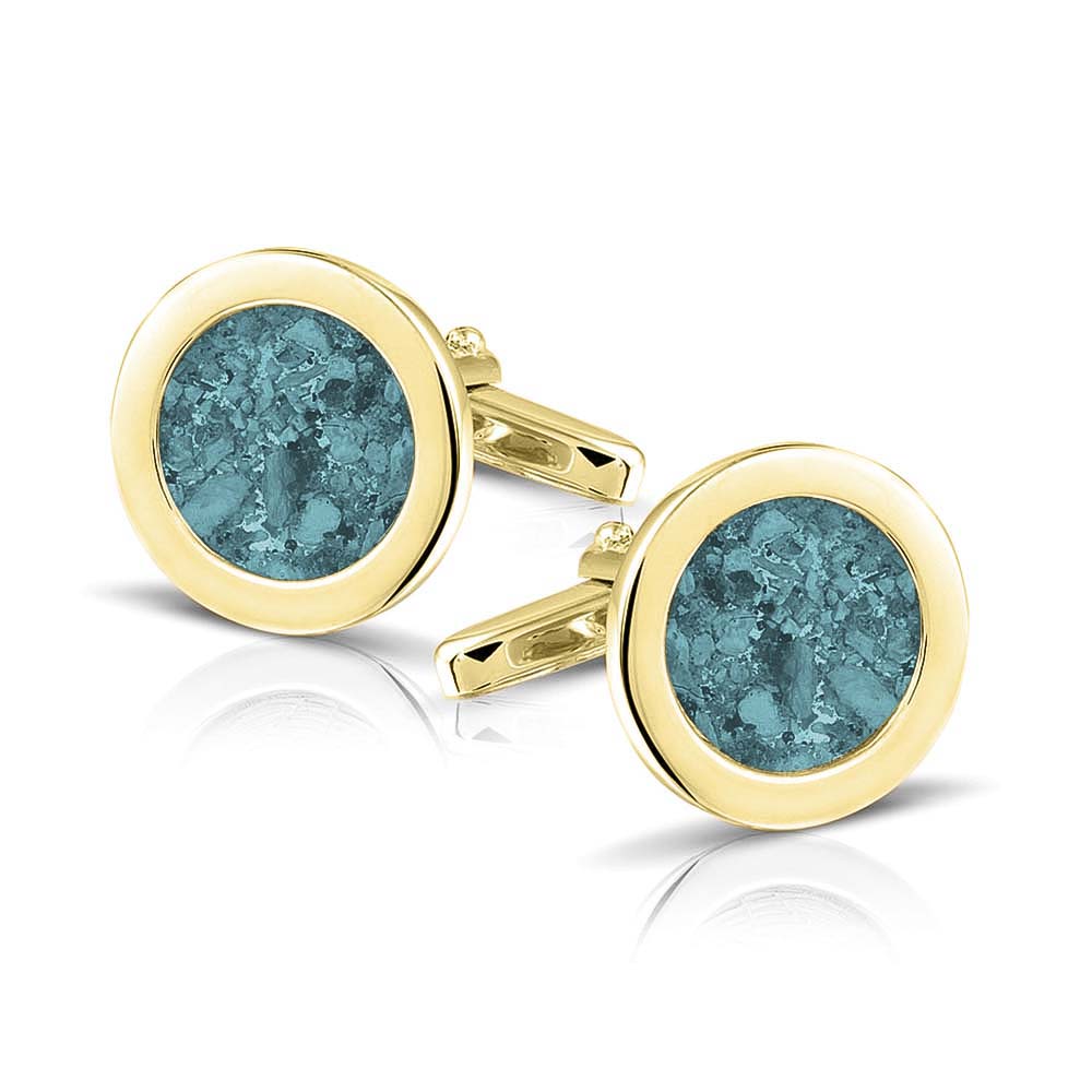 Ronde manchetknopen met as, zichtbaar gevuld, als herinneringssieraad. Aqua