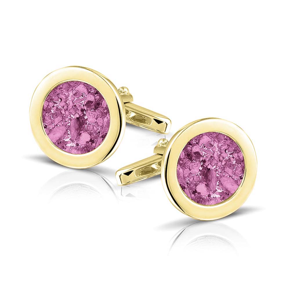 Ronde manchetknopen met as, zichtbaar gevuld, als herinneringssieraad. Fluo