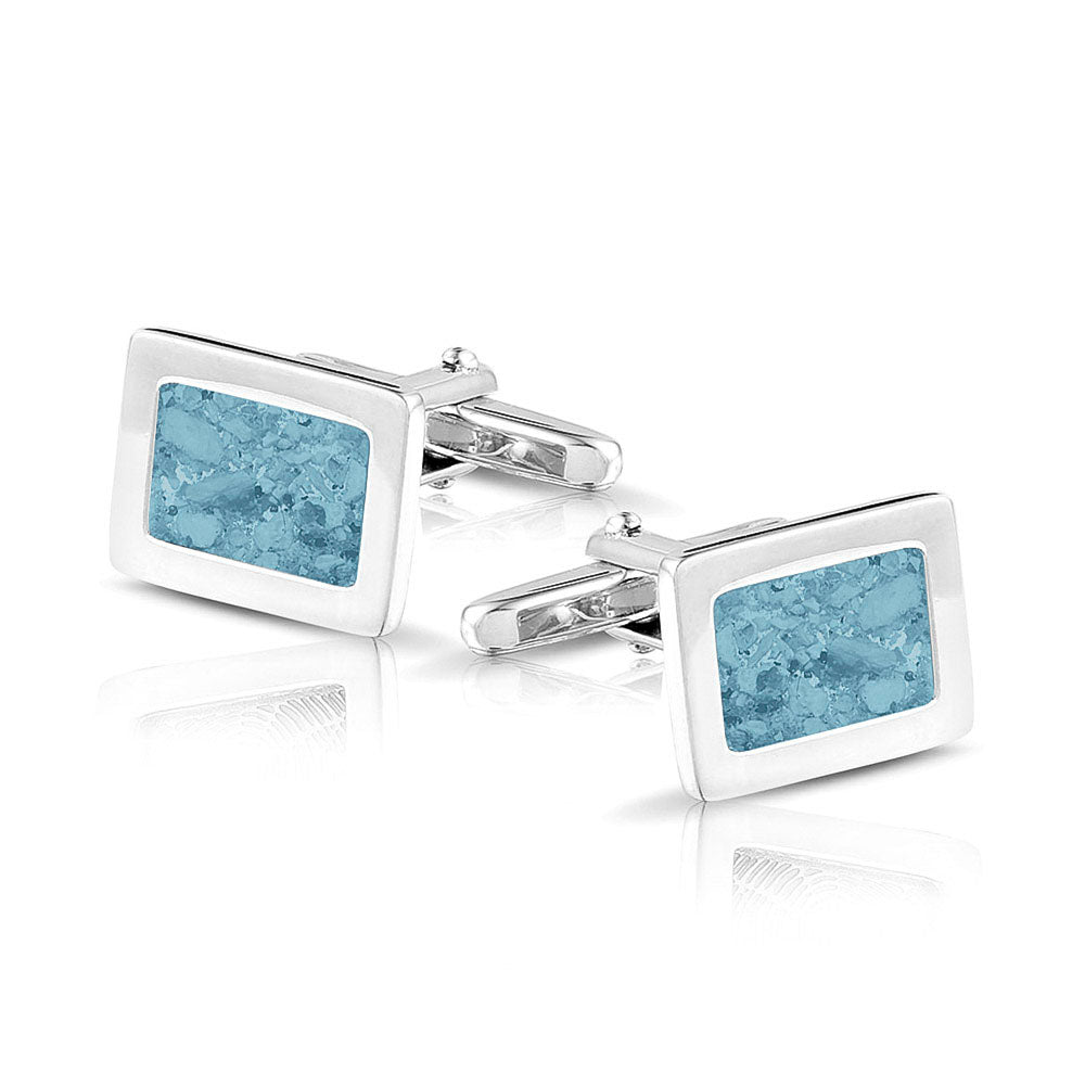 Manchetknopen met as, zichtbaar gevuld, als herinneringssieraad. baby