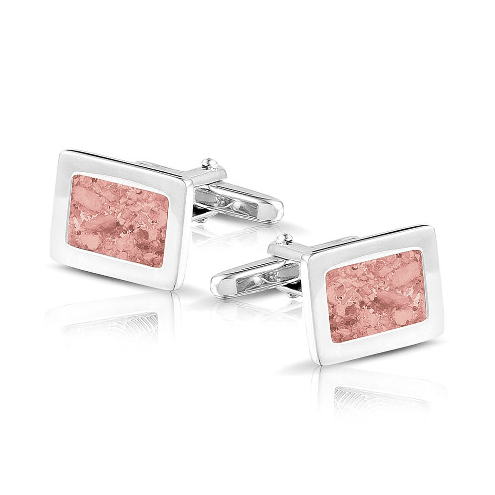 Manchetknopen met as, zichtbaar gevuld, als herinneringssieraad. blush