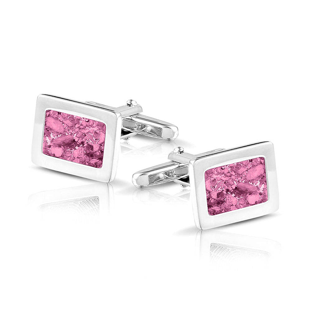 Manchetknopen met as, zichtbaar gevuld, als herinneringssieraad. fluo