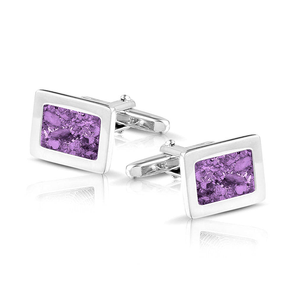 Manchetknopen met as, zichtbaar gevuld, als herinneringssieraad. purple