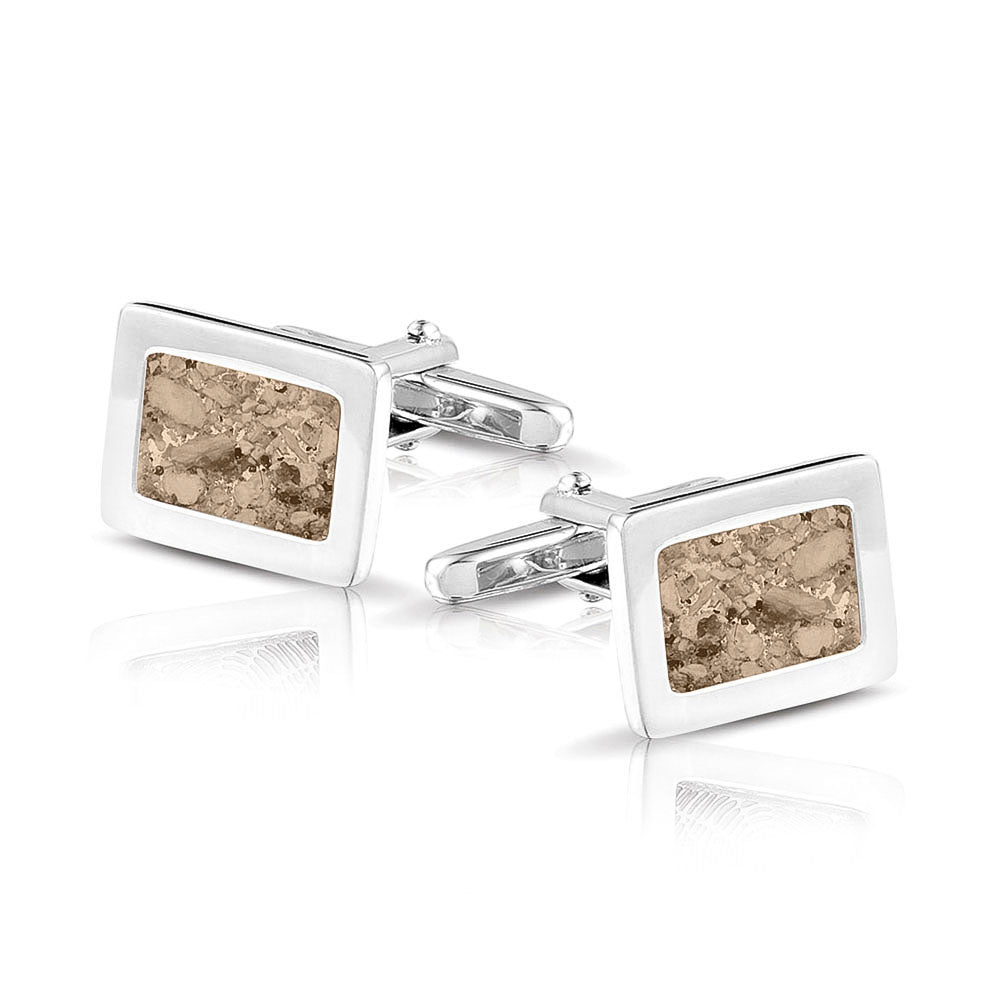 Manchetknopen met as, zichtbaar gevuld, als herinneringssieraad. transparent