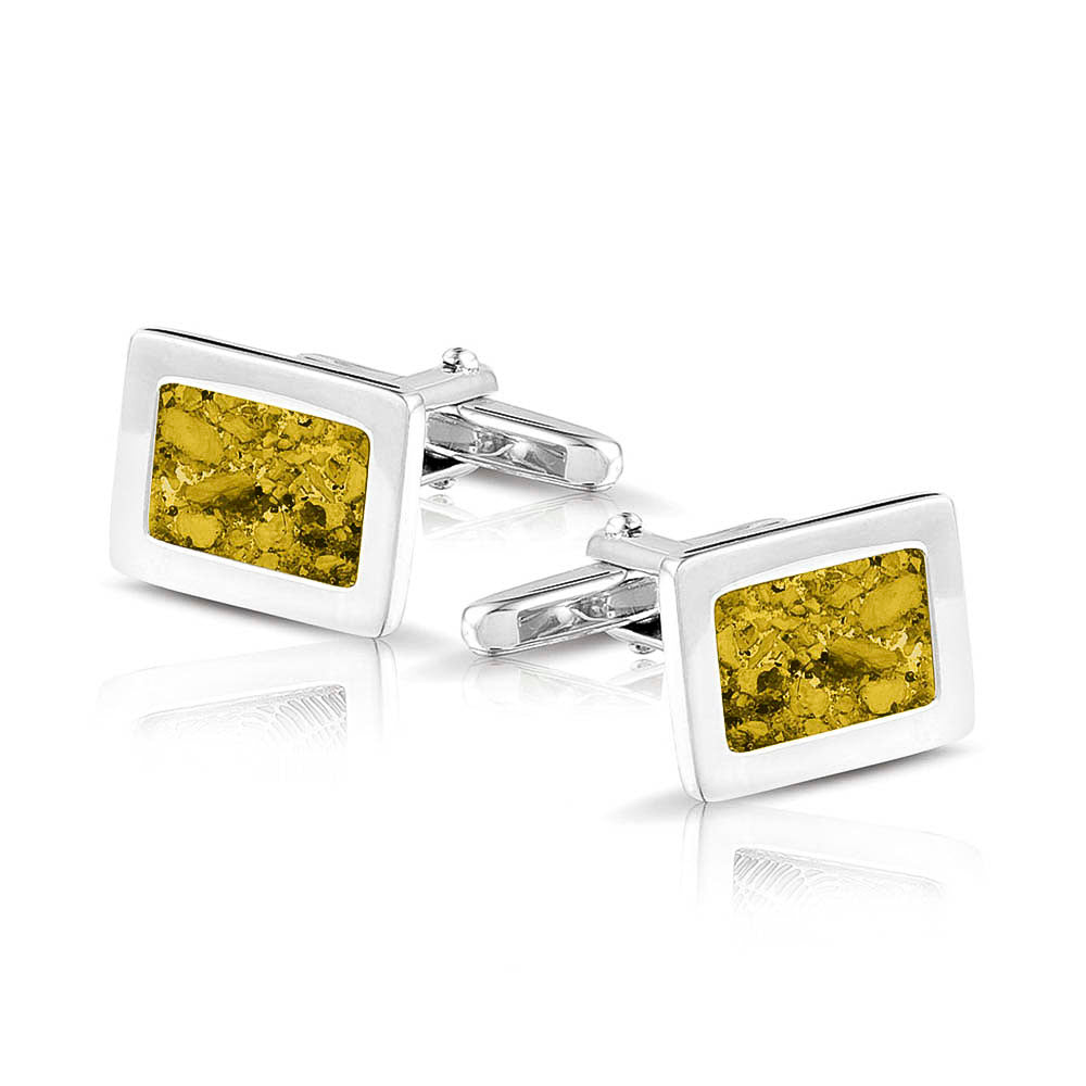 Manchetknopen met as, zichtbaar gevuld, als herinneringssieraad. yellow