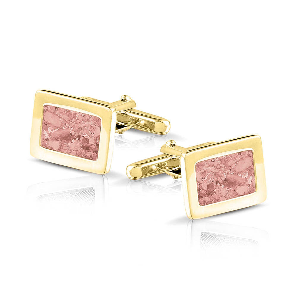 Manchetknopen met as, zichtbaar gevuld, als herinneringssieraad. blush