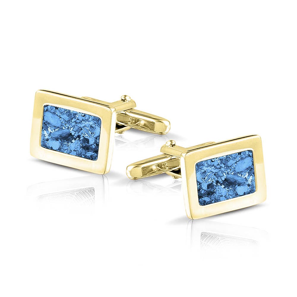 Manchetknopen met as, zichtbaar gevuld, als herinneringssieraad. marine