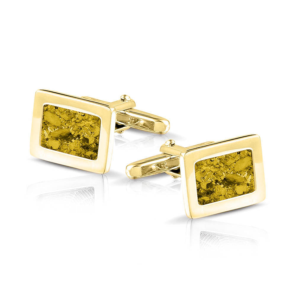 Manchetknopen met as, zichtbaar gevuld, als herinneringssieraad. yellow