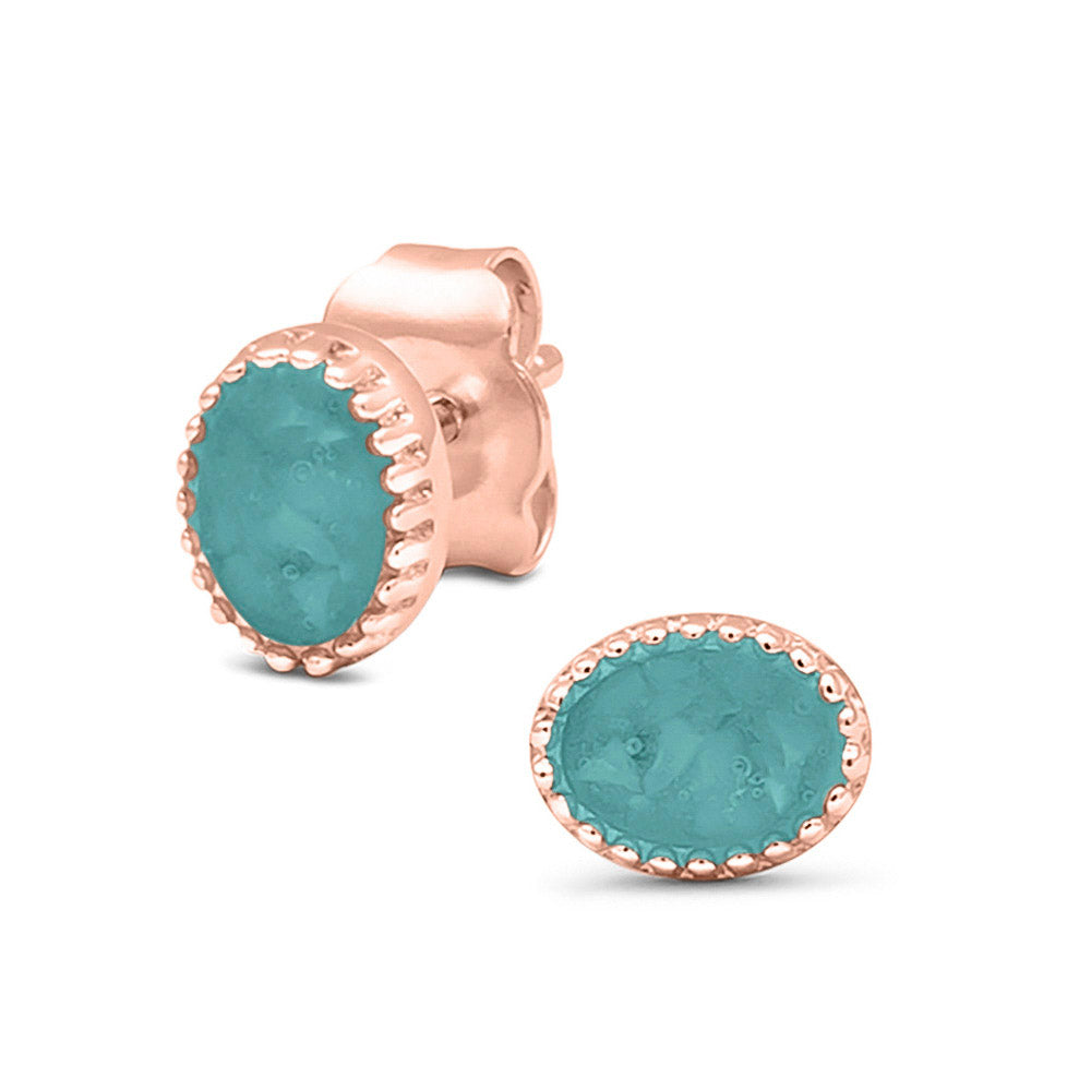 Ovaal gevormde oorstekers, aan de voorzijde zichtbaar gevuld met as of haar. Aqua