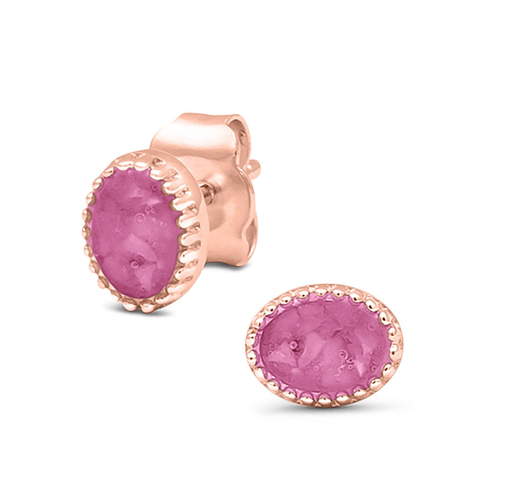 Ovaal gevormde oorstekers, aan de voorzijde zichtbaar gevuld met as of haar. Fluo