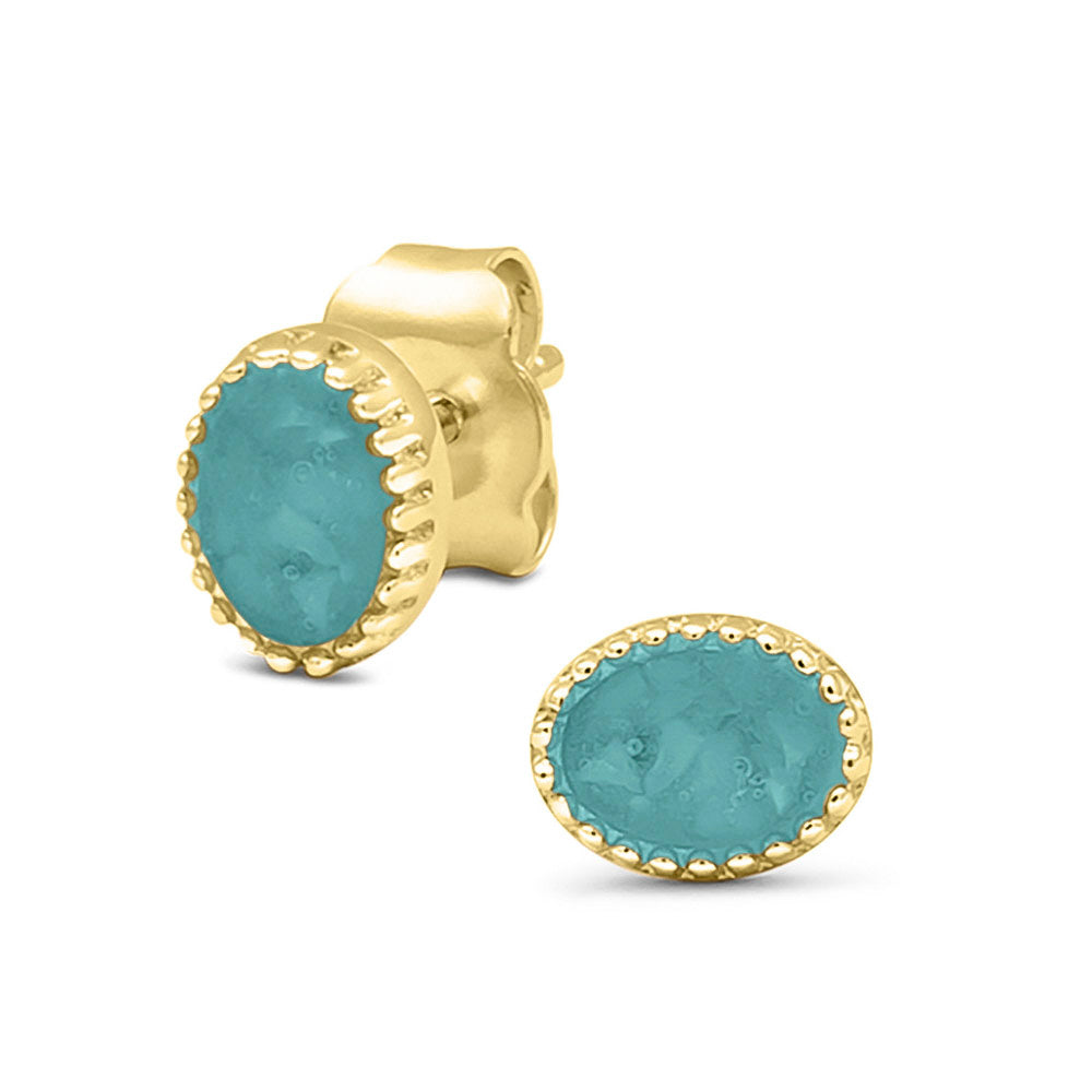 Ovaal gevormde oorstekers, aan de voorzijde zichtbaar gevuld met as of haar. Aqua