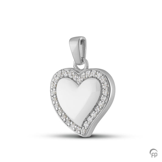 Hanger in hart vorm, in zilver uitgevoerd met zirkonia's, in goud met diamanten.  De ashangers uit deze collectie gedenksieraden zijn zelf te vullen.