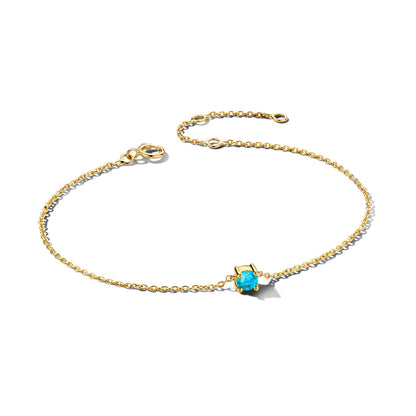 Exclusieve 14 KT geelgouden anker armband met geboortesteen in chatonzetting.