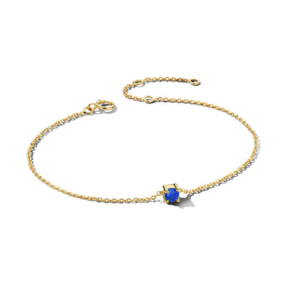 Exclusieve 14 KT geelgouden anker armband met geboortesteen in chatonzetting.