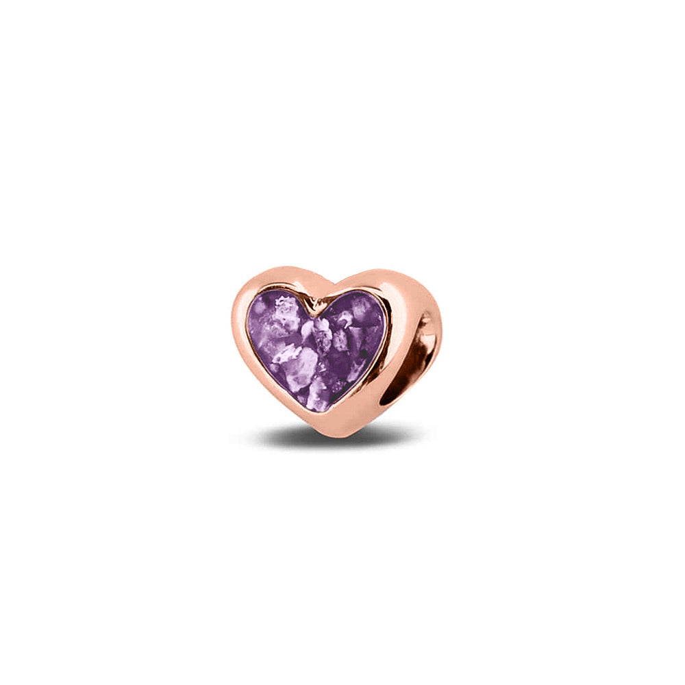 Hartvormige asbedel, aan beide zijdes zichtbaar gevuld met as of haar. Het vullen en sealen met onze speciale hars met een keuze in 20 kleuren, wordt in onze ambachtelijke edelsmederij gedaan. Purple