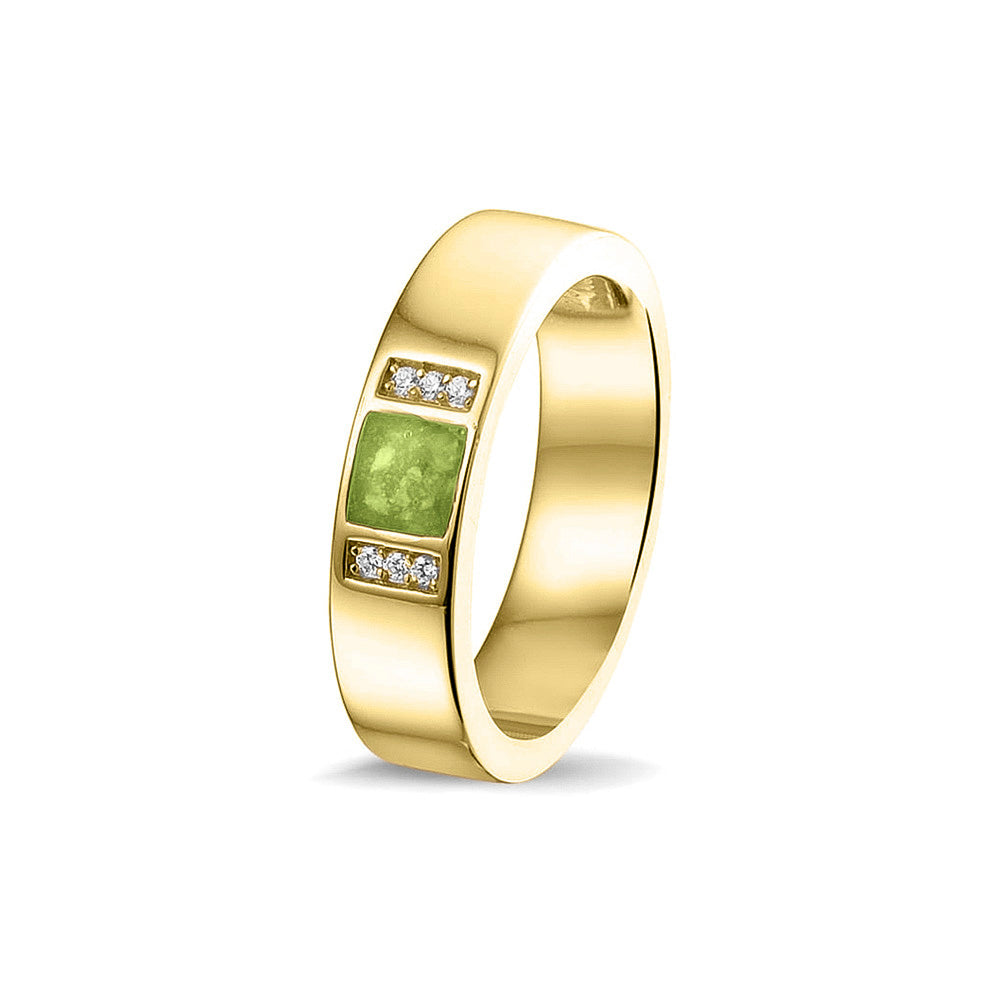 Ring uit onze serie gedenksieraden, waar zichtbaar as of haar verwerkt wordt in twee separate compartimenten geflankeerd door zes stuks zirkonia's of diamanten naar keuze. Green