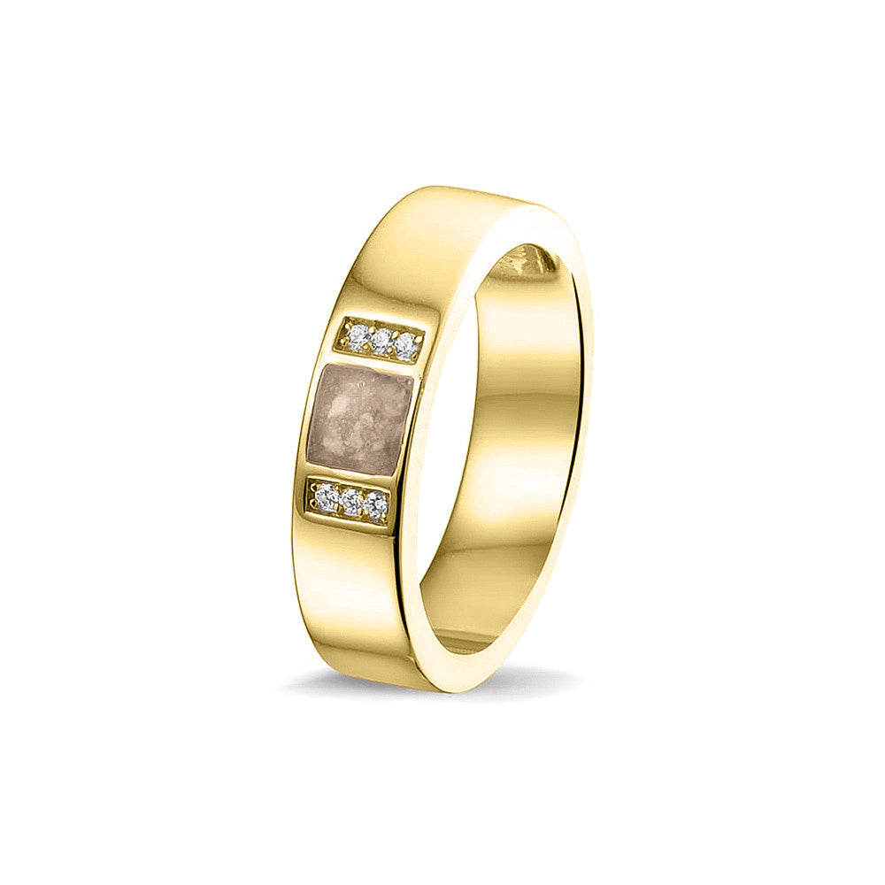 Ring uit onze serie gedenksieraden, waar zichtbaar as of haar verwerkt wordt in twee separate compartimenten geflankeerd door zes stuks zirkonia's of diamanten naar keuze. Transparent