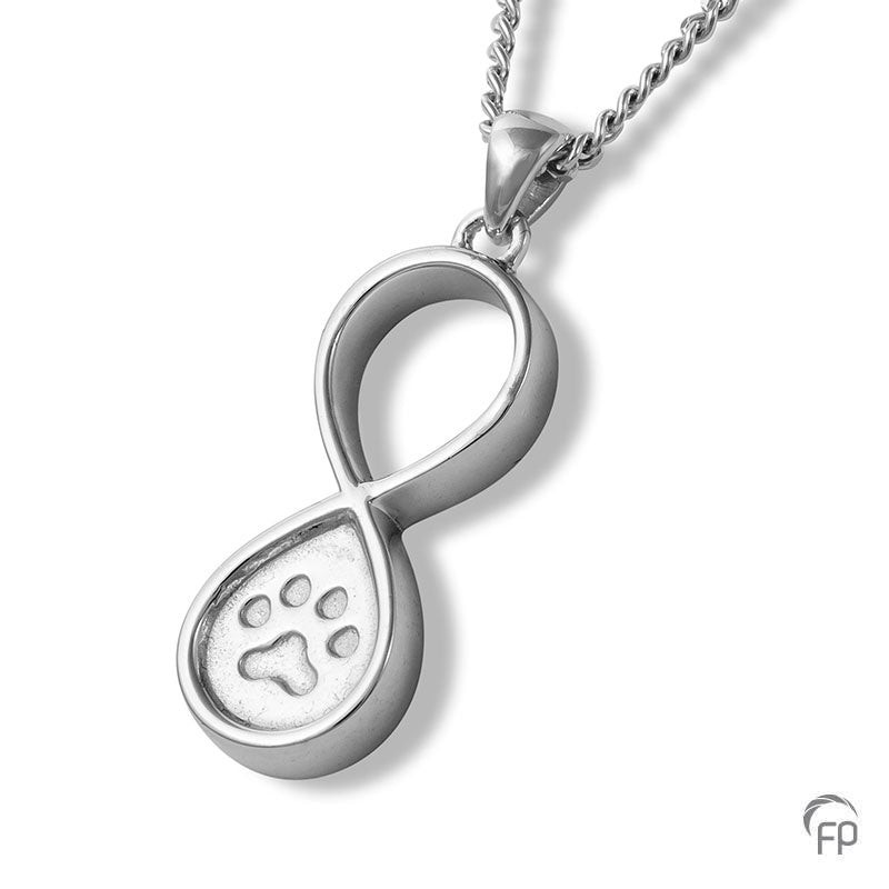 Deze zilveren 925 sterling ashanger infinity met pootafdrukje kenmerkt zich door het fraai en speels ontworpen karakter. Dit gedenksieraad kan met as en ook met haar van je huisdier gevuld worden. 